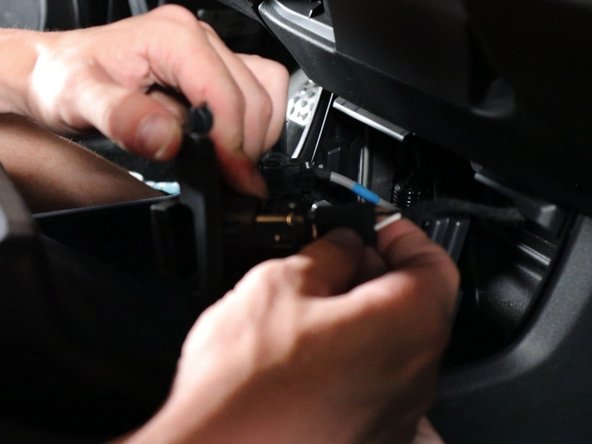 Unplug them all and remove the panel from the car.