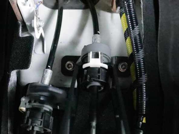 It may be necessary for you to push the shifter cable forward slightly in order for the holes to line up on the chassis. This is normal and will not cause any issues.