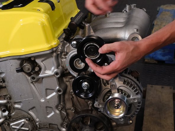 Align the logo and use the supplied bolt.