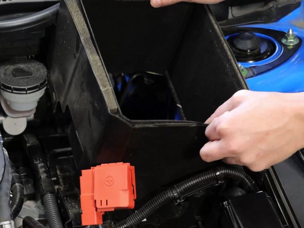 Remove the battery, protective padding, and then plastic undertray.