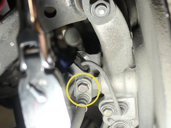Remove the 10mm bolt that mounts the brake like to the wheel hub.