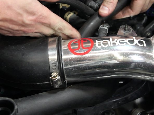 With a pair of pliers, remove the air intake accessory tubes.