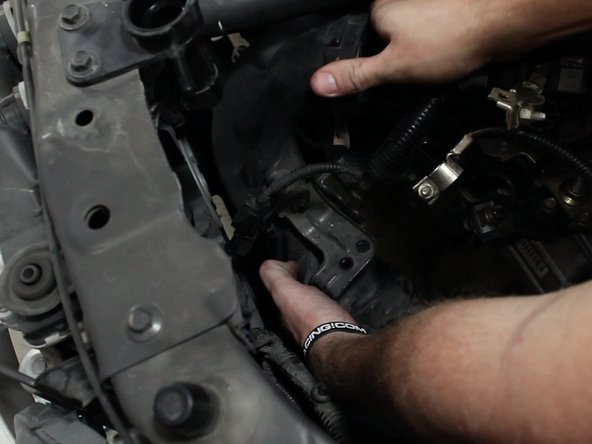 Remove the upper portion of the air intake tube.