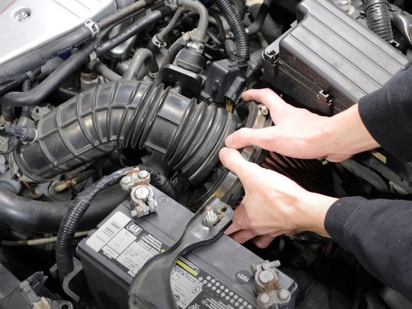 Remove the air filter, or airbox to gain access to the top of the transmission.
