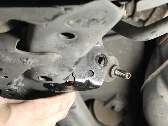 Prepare the removal of the 14mm nut with penetrating oil for easy removal. Use an Allen wrench to keep the end link from turning as you loosen the nut.