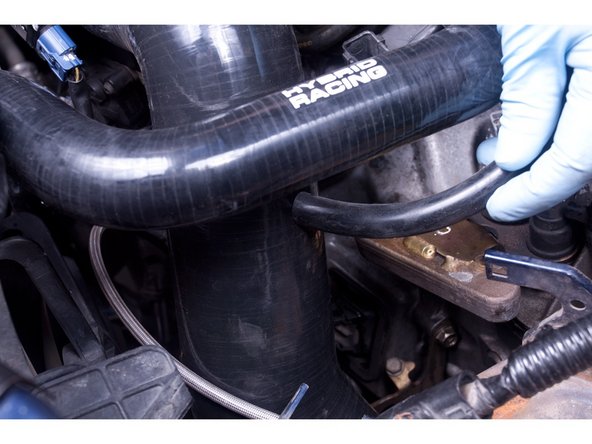 (Optional) If you want to install the valve cover breather tube, connect the supplied tube and route it to a spot on the intake tube. If you choose to NOT make this connection DO NOT DRILL A HOLE FOR IT and move to step 7.