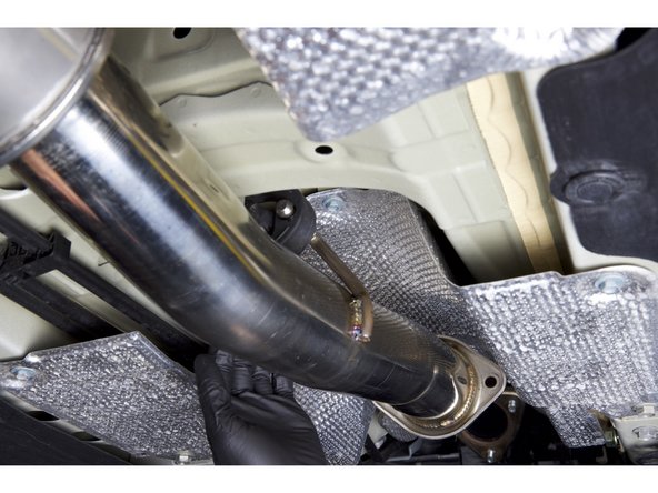 Begin by installing the mid-section of the HR exhaust. You can take this section and hang it from the center hanger.