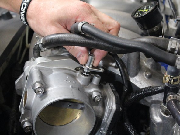 Place the vacuum fitting into the port.