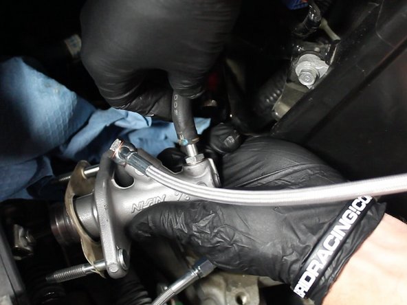 Bleed the system and adjust the CMC rod accordingly for proper clutch engagement. Tighten the clutch interlock switch sensor once the adjustment has been made.