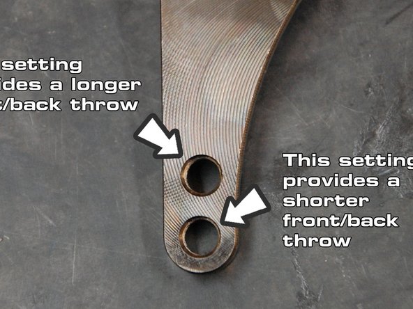 To adjust the shifter’s throw, loosen the bolt that each cable mounts to from the cable’s steel rocker.