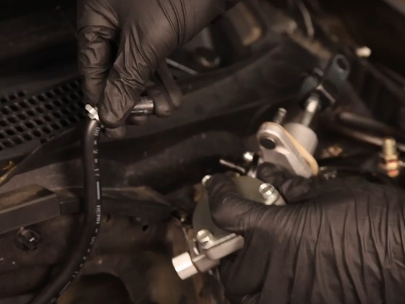 Remove the reservoir line hose and secure to the crown with the supplied zip tie.