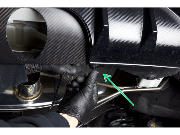 Install the HR carbon rear panel into the bumper using the factory clips. This panel should sit flush at the top and around the bumper seam.