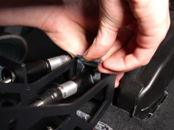 Reinstall the shifter cable clips and secure them in place with a mallet if necessary.
