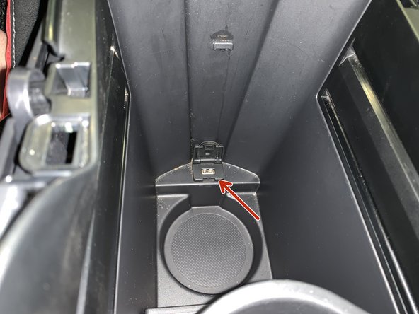 Remove the console light as well as the lower USB connector.