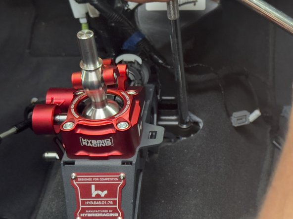 Use the supplied 10mm bolts and install the Hybrid Racing shifter directly to the chassis.