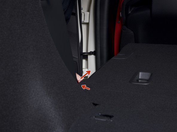 Route the power harness around the corner of the rear seat and down through the rear panel. Conceal the wire as best as you can.