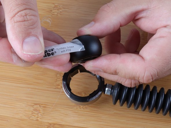 Even though the bushing and Delrin ring are very smooth, we recommend adding a bit of Super Lube grease with PTFE to the center bushing.