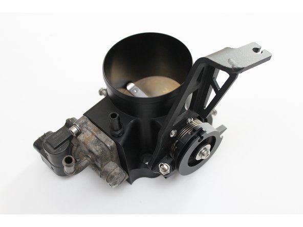 Use the two supplied bolts and secure the IACV to the housing.