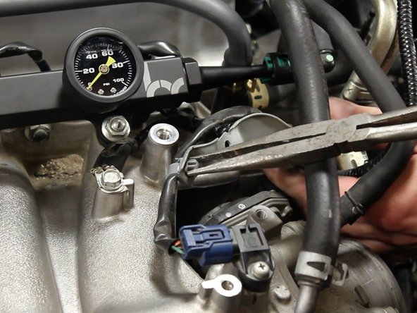 Unclamp the MAP sensor wire harness from the bracket and discard the bracket.