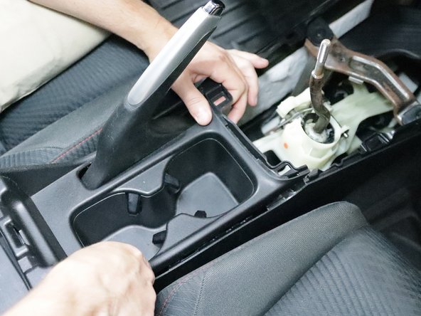 Work your way towards the arm rest and pop it free.