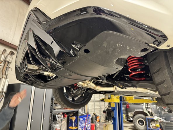 Once the exhaust is on and tight, you can reinstall the rear lower bumper panel.