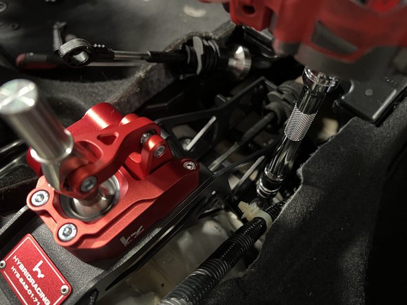 Use the supplied hardware and bolt the shifter base to the chassis.