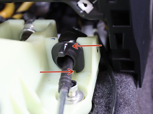 Remove RH side shifter cable from the shifter by twisting the cable counter-clockwise and lifting it up.