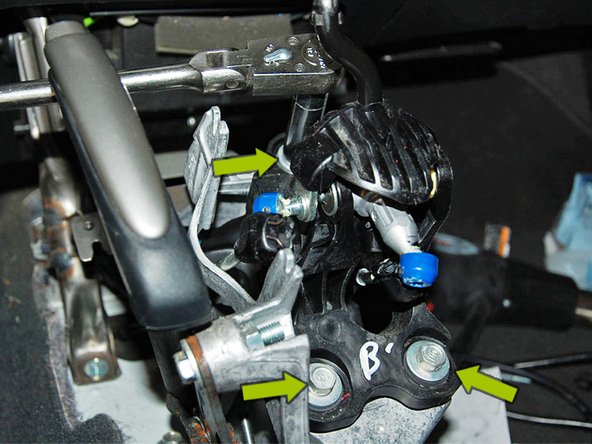 Using your 12mm socket, remove the (3) bolts mounting the shifter to the car.