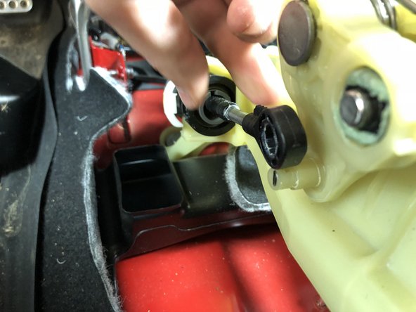 Locate the LH side shifter cable end and remove the clip holding it place. Slide the cable end off the shifter.