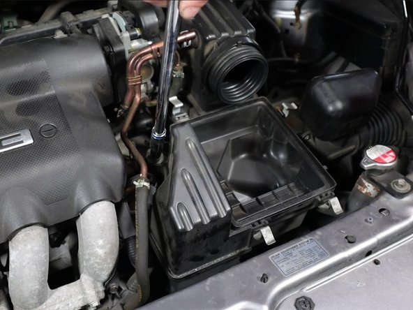 Unbolt the airbox and remove it.