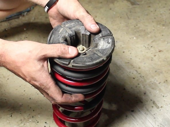 Install upper spring perch on the new spring.