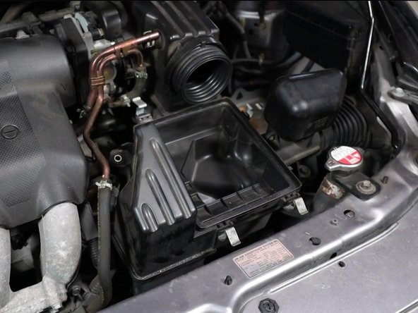 Remove the throttle body clamp.