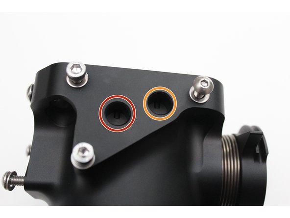 The port circled in RED is for the Purge Control Solenoid Valve. This is an emissions sensor used on the Acura RSX chassis. Insert a plug &amp; retaining ring into this port if you are not using this sensor.