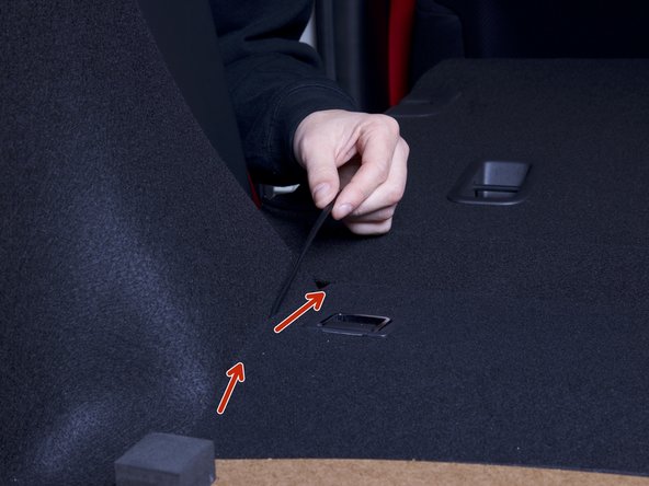 Route the power harness around the corner of the rear seat and down through the rear panel. Conceal the wire as best as you can.