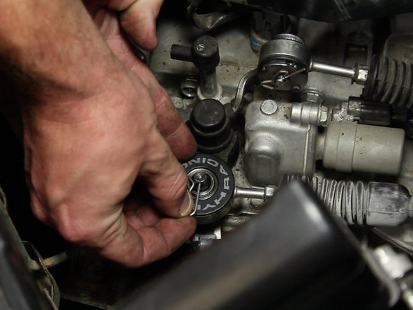 Be sure to slide the retaining ring around to ensure it holds the bushing in place.