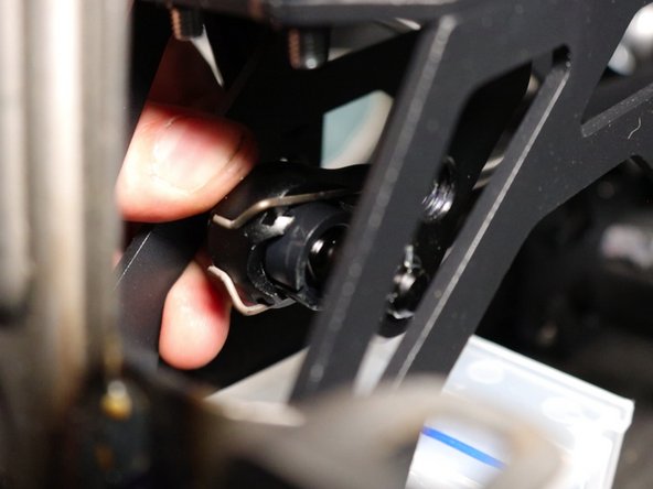 Inside the car, attach the cables to the shifter.