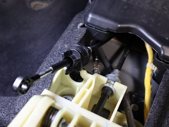 Remove the Front Left bolt from the shifter assembly.