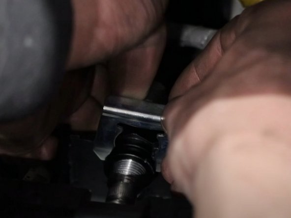 Use the supplied spring clips and install the cables to the shifter. You may need to use an extension or punch.