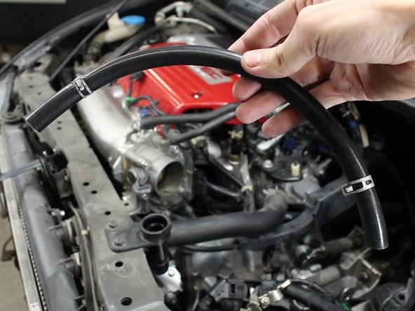 Your intake system should include a new upper IACV coolant hose. Be sure to use the OEM hose clamps.