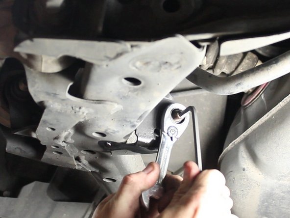 Remove the rear sway bar end links for both sides of the car. It is located on the lower control arm.