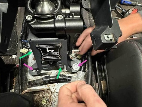 As you place the shifter into the center console, route cables into and through the shifter frame.