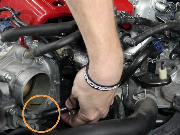 Install the line from the upper section of the IACV located on the throttle body and the coolant housing.