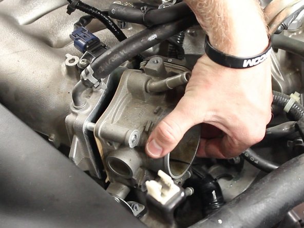 Remove the stock throttle body, the gasket will remain attached to the throttle body.