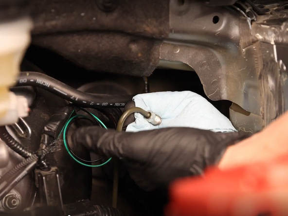 Use a hardline wrench and unbolt the clutch line from the CMC.