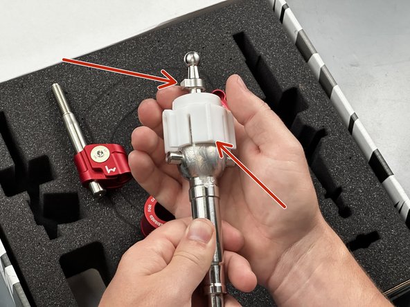 With the notch pointing left locate the Shifter Pivot Seat (#8) and slide it down onto the ball.