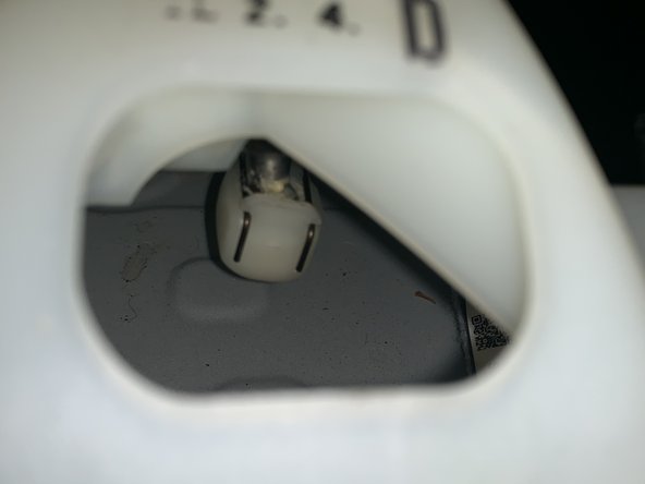 Use your fingers to seperate the clip on the RH side shifter cable. Push them up and apart and the cable end link will slide off the ball.