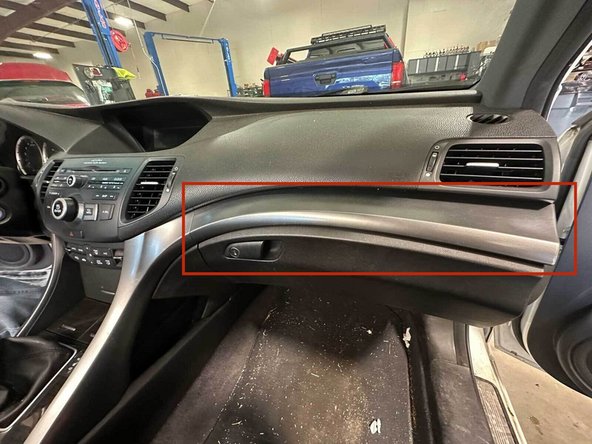 Place two hands on the dashboard trim and gently pull towards you until the trim pops out. You can work each side if they are stuck.