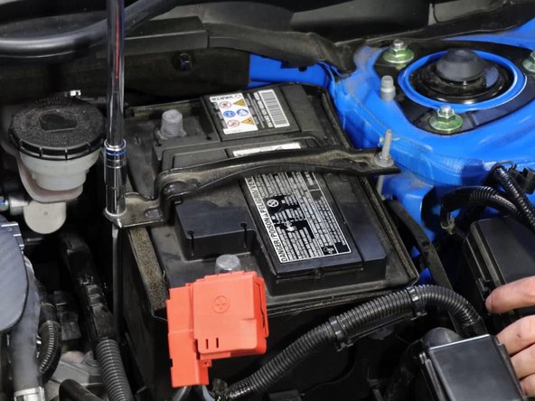 Remove the battery tie-down bracket.