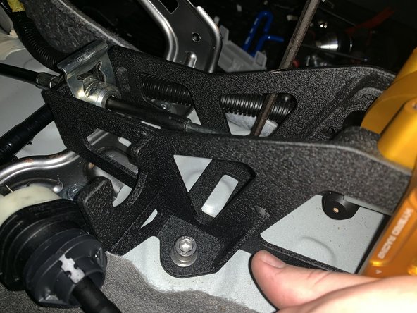 Install the Hybrid Racing shifter and use the supplied bolts to mount it directly to the chassis. It does not use any sort of base bushing.