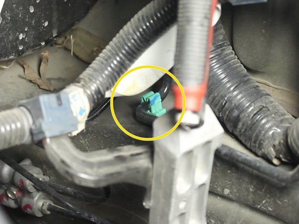 Locate the three mounting locations for the factory clutch line. Un-clip them all now.